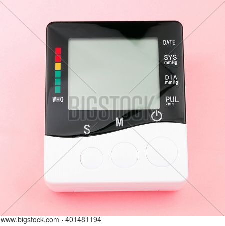 Blood Pressure Monitor On Pink Background At Dry Sunny Summer Day