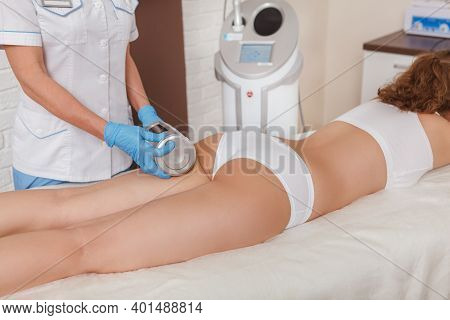 Unrecognizable Woman Enjoying Endospheres Massage At Cosmetology Salon