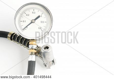 Pressure Gauge For Measuring Air Pressure In Car Tires On A White Background