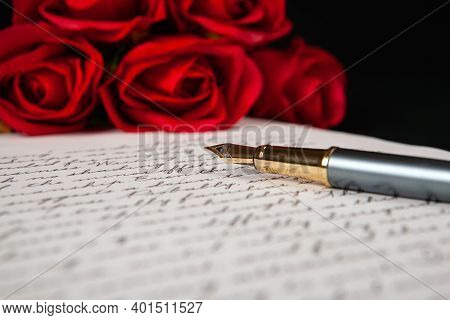 Fountain Pen On Letter With Text And Red Roses Close Up