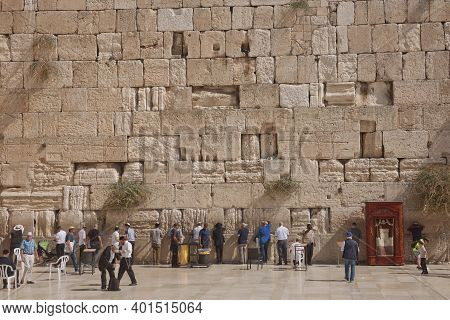 People Praying At The Western 'wailing' Wall Of Ancient Temple In Jerusalem. The Wall Is The Most Sa