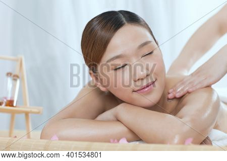 A Young Woman Enjoy Massage High Quality Photo