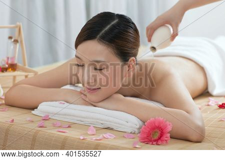 A Young Woman Enjoy Massage High Quality Photo