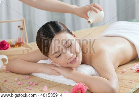 A Young Woman Enjoy Massage High Quality Photo