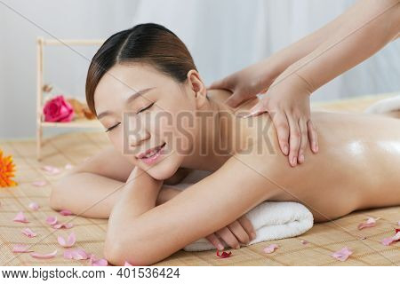 A Young Woman Enjoy Massage High Quality Photo