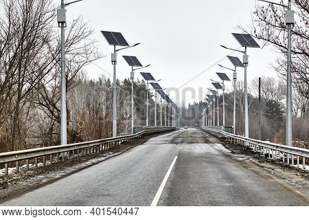 Asphalt Road On The Bridge. Solar Bridge Road Lighting. Landscape With A Road.ecological Street Ligh