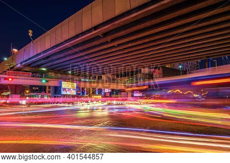 Bangkok, Thailand - December 3, 2020: Beautiful Night Time Image Of Traffic On Ratchada Road With Lo