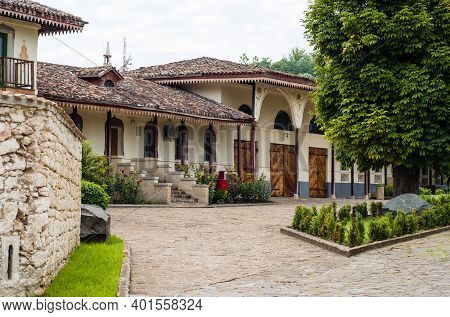 Khans Palace In Bakhchisarai. Ancient Tatar Buildings Among Trees And Flowers. Beautiful Summer Land