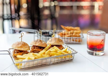 Mini Burgers With French Fries And Cocktail Served At The Bar, Finger Food