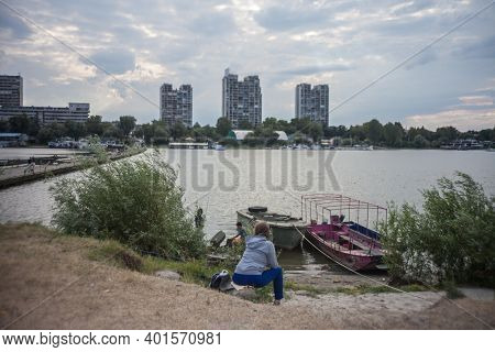Belgrade, Serbia - July 15, 2017: Selective Blur On Woman Sitting And Thinking In Front Of Pontoon B