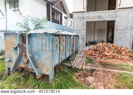 Garbage Roro Dumpter Bin Collects Rubbish At Construction Site