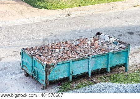 Garbage Roro Dumpter Bin Collects Rubbish At Construction Site