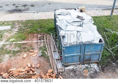 Garbage Roro Dumpter Bin Collects Rubbish At Construction Site