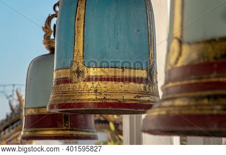 Ancient Bells Hanging On Pillars Outside In The Thai Temple. Thai Temple Bell Which Believe That Who