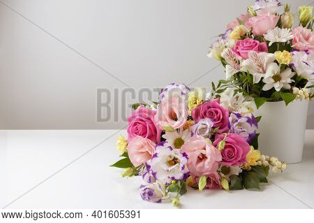 Two Bouquets Of Different Sizes Of Roses, Daisies, Lisianthus, Chrysanthemums, Unopened Buds In A Wh