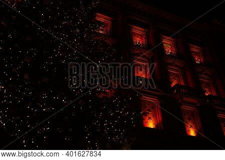 Dark Night At Paradeplatz At Christmastime. Illuminated Windows With Big Christmas Tree. Zurich, 19.