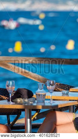 Cold Rose Wine Served In Beach Cafe With View On Blue Water Of Gulf Of Saint-tropez, French Riviera,
