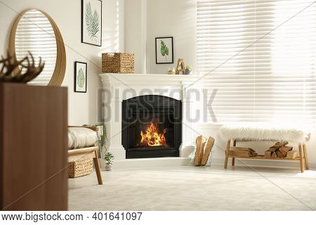 Bright Living Room Interior With Artificial Fireplace And Firewood