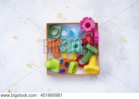 Mock Up Background Educational Constructor For Children, Nuts And Bolts In The Form Of Geometric Sha