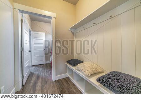 Mud Room Interior Of A House With Hooks Shelves And Built In Bench With Pillows