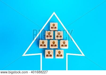 A Group Of People In The Arrow. Movement In A Single Formation. Joint Achievement Of Goals And Tasks