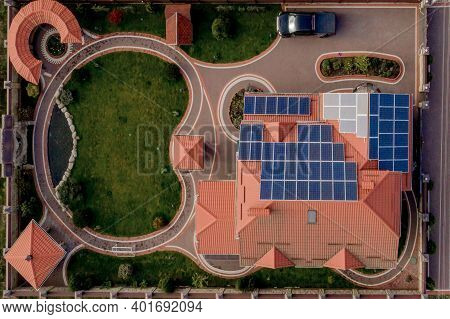 Aerial Top View Of New Modern Residential House Cottage With Blue Panels. Renewable Ecological Green