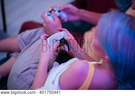 Handsome Young Man Teaching How To Play The Video Games To His Girlfriend, On The Couch, Concept Abo