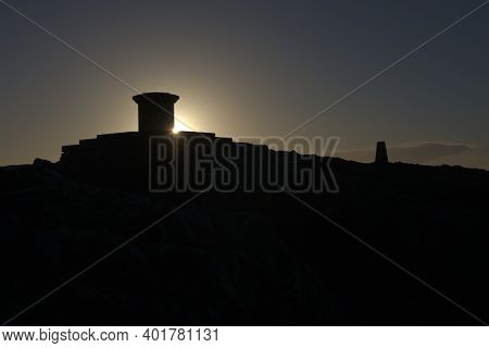 Dark Early Morning Sunrise Behind The Summit Of The Worcestershire Beacon. Featuring The Toposcope A
