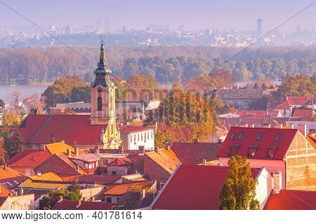 Belgrade, Serbia Panoramic Aerial City View Of Zemun Houses With Church Tower At Sunset