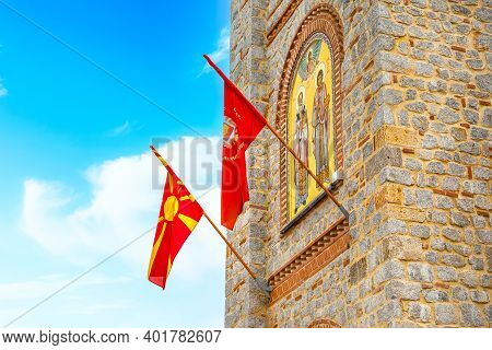Ohrid, North Macedonia, Close-up St. Clement Church At Plaosnik Site With Flags And Mosaic Icon On T