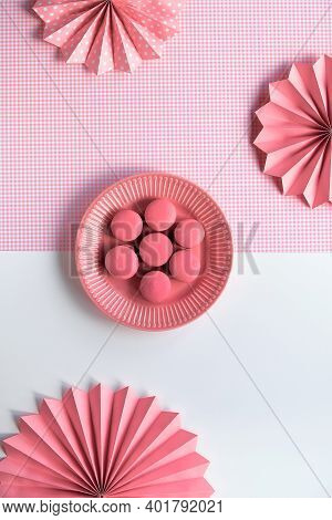 Creative Food Concept. Macaroons On A Plate. Monochrome Flat Lay On Split Two Tone Pink White Backgr