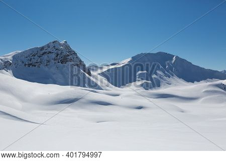 Snowcapped Valbellhorn And Sandhubel Mountains Near Arosa In Winter
