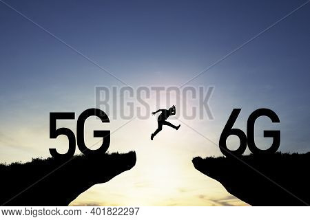 Technology Transformation Change  From 5g To 6g , Silhouette Businessman Jumping From 5g Cliff To 6g
