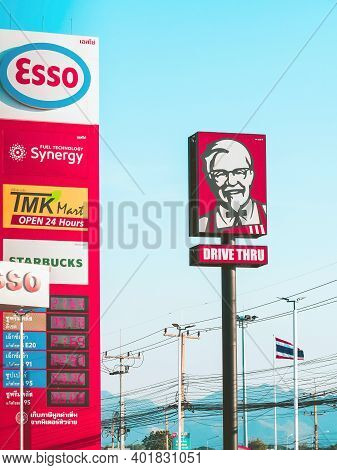 Kanchanaburi, Thailand-december 31,2020 : Kfc Drive Thru Logo Billboards On A Pole Along With Leadin
