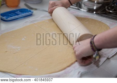 Cook Rolls Out Dough With Rolling Pin - Close-up Of Kneading Dough