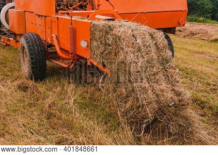 Old Bale Press, Hay Harvesting In The Village For Cattle, Press Work Close Up.