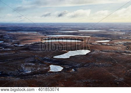 Aerial View Over The Landscapes Of Taimyr. Tundra From Above. Image Of The Landscape Of The Taimyr P