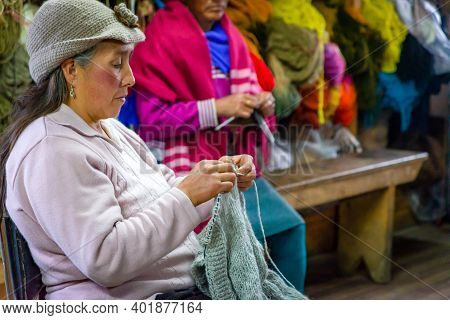 Guaranda, Bolivar, Ecuador - November, 2013: Women In A Textile Manufacturer Shop, Sowing And Fabric