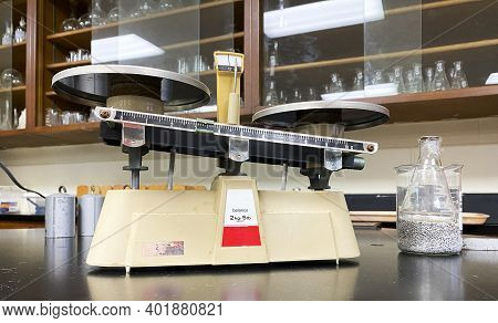 High School Science Lab Table With A Scale And Glassware Set Up For Kids To Do A Lab.