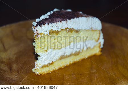 Cheese Cream Cake Served On A Wooden Dish