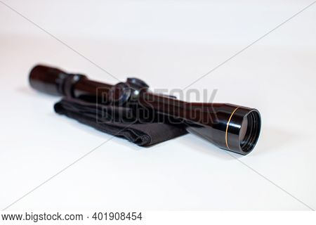 A Compact, 3x9 Magnification Scope Sits On A White Background, Ready To Be Mounted On A Rifle To Hel