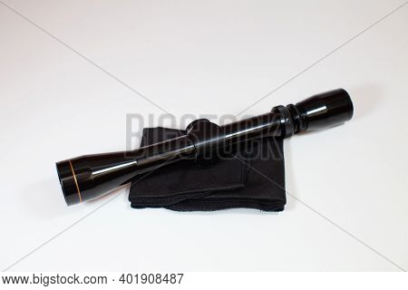 A Compact, 3x9 Magnification Scope Sits On A White Background, Ready To Be Mounted On A Rifle To Hel