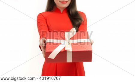 Portrait Of Cheerful Asian Young Lady In Vietnamese Tranditional Costume  With Giftboxes Preparing F