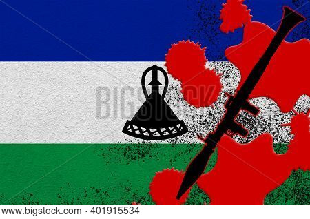 Lesotho Flag And Black Rpg-7 Rocket-propelled Grenade Launcher In Red Blood. Concept For Terror Atta