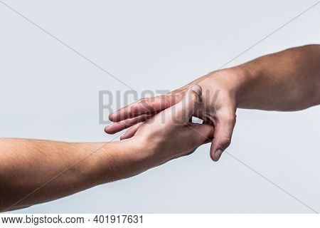 Two Hands, Helping Arm Of A Friend, Teamwork. Rescue, Helping Gesture Or Hands. Close Up Help Hand. 