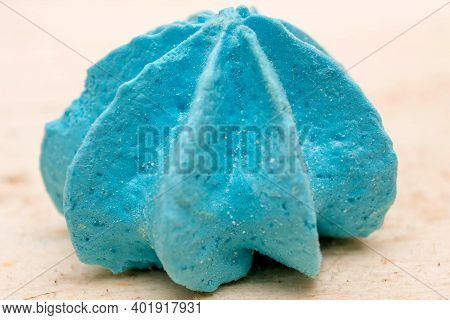 Blue, Sweet, Crispy Meringue Close-up On A Wooden Background.