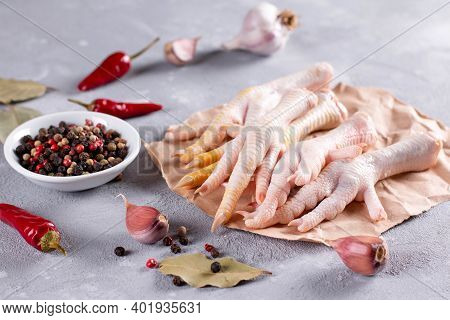 Raw Chicken Feet With Herbs For Making Bone Broth. Natural Collagen Of Animal Origin