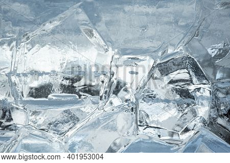 Abstract Ice Background. Blue Background With Cracks On The Ice Surface. Ice Background Texture. Blu