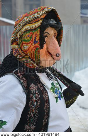 Man In A Festive Costume And Woman Mask