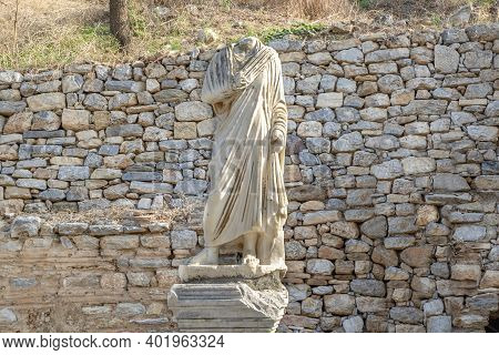 Headless Man Figure In Front Of Brick Wall In Ephesus Ancient City